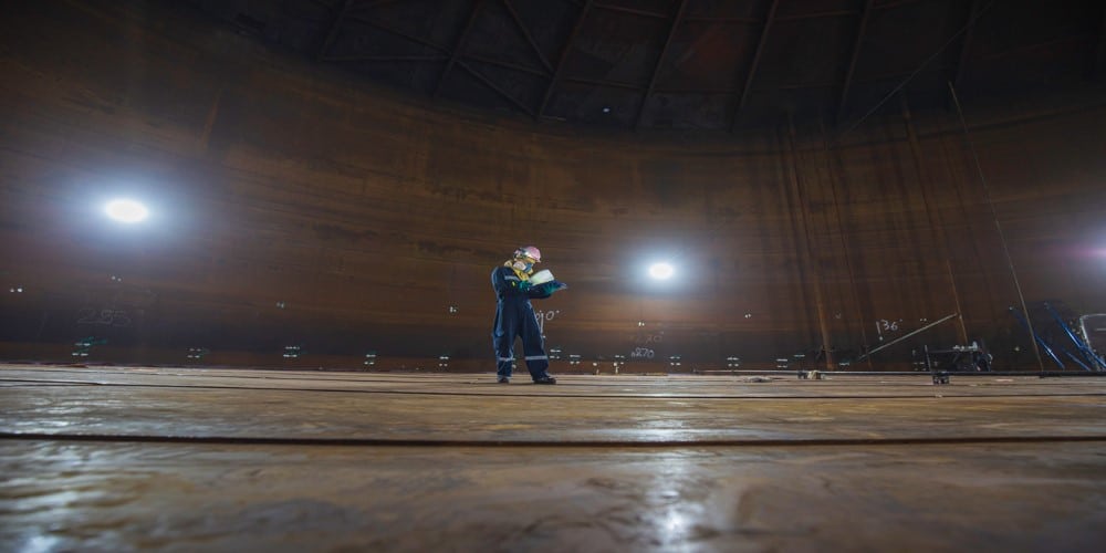 Man inside huge industiral tank